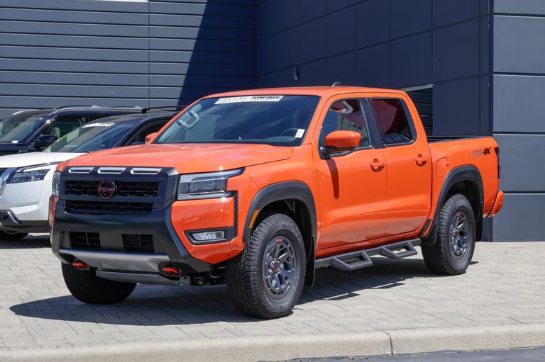 Nissan Frontier PRO-4X Crew Cab 4X4 pickup display at dealership with 310HP V6 engine