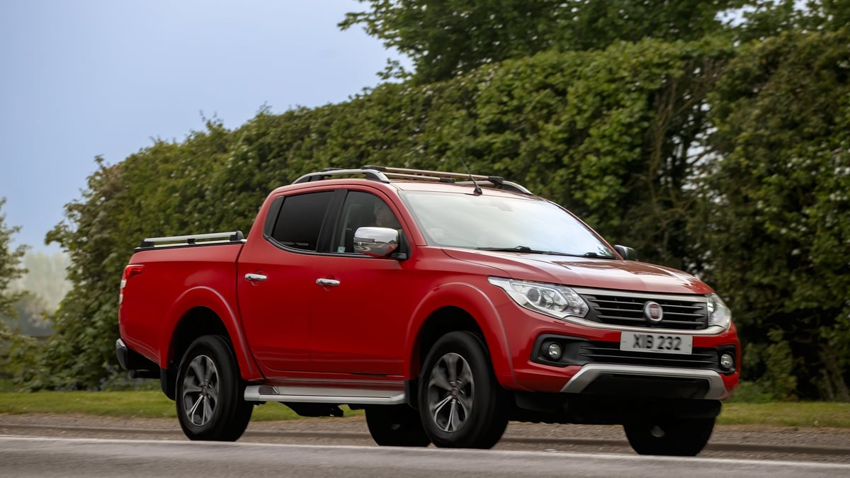 2018 red Fiat pickup truck car driving on a British road