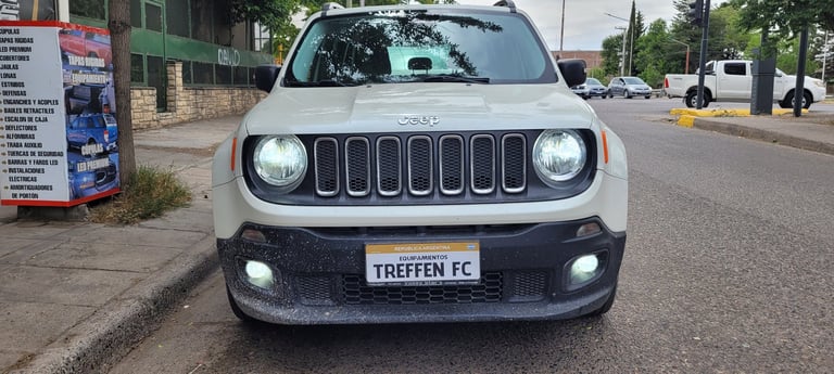 White Jeep Renegade SUV parked on street with TREFFEN FC license plate, front view